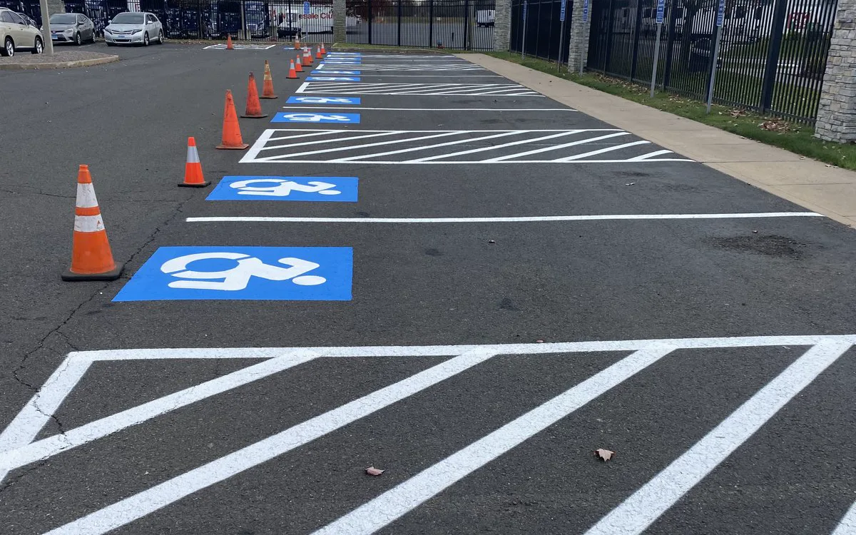 Freshly painted accessible parking stalls at a Connecticut business lot striped by Green Chief
